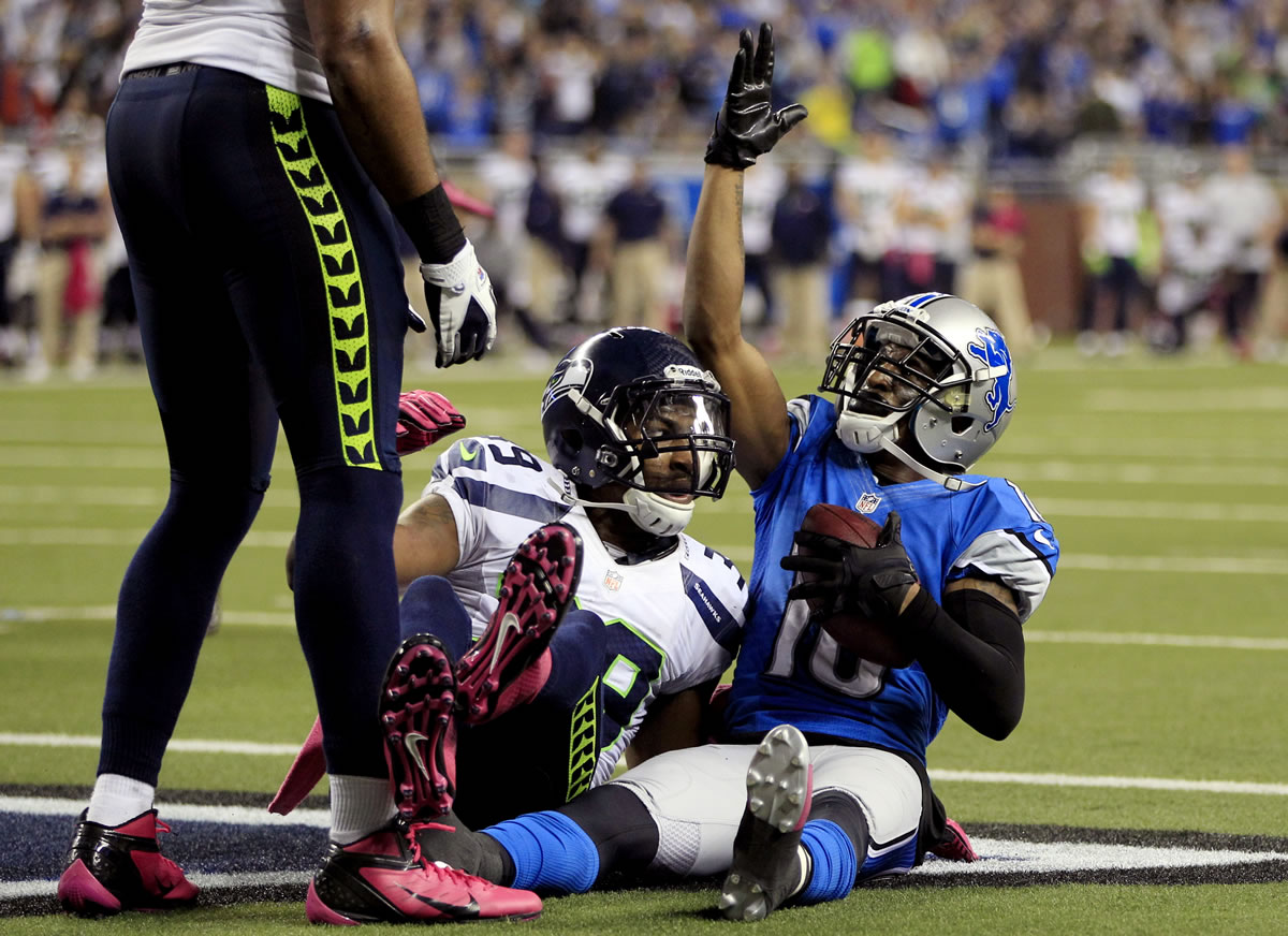 Detroit Lions wide receiver Titus Young (16) celebrates his winning touchdown reception against Seattle Seahawks cornerback Brandon Browner (39) in the end zone during the second half of an NFL football game, Sunday, Oct. 28, 2012. in Detroit. The Lions won 28-24.