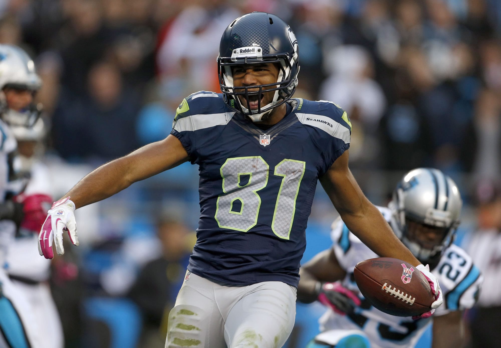 Seattle Seahawks' Golden Tate (81) reacts after his touchdown catch against the Carolina Panthers during the third quarter of an NFL football game in Charlotte, N.C., Sunday, Oct. 7, 2012.