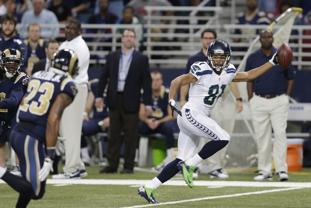 Seattle Seahawks wide receiver Golden Tate (81) runs to the end zone for a touchdown during the second half of an NFL football game against the St. Louis Rams, Monday, Oct. 28, 2013, in St. Louis.