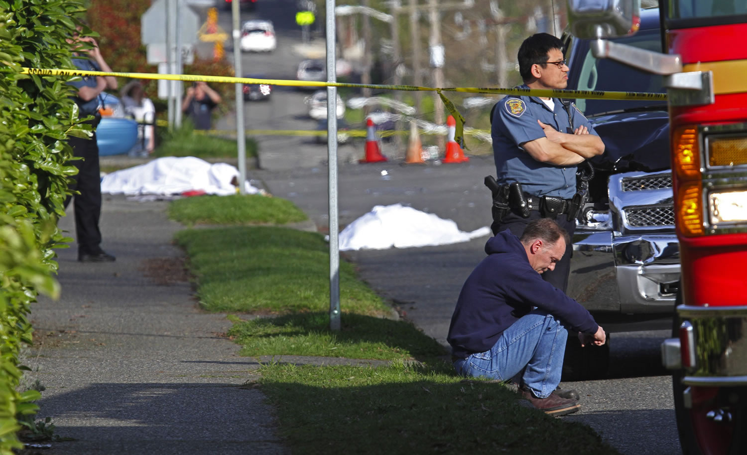 A pickup struck four pedestrians crossing a Seattle street March 25, killing two and critically injuring two others -- a woman and the infant she was carrying, police said. The driver, sitting on the grass, Mark W. Mullan, now 51, of Seattle, pleaded guilty Oct.