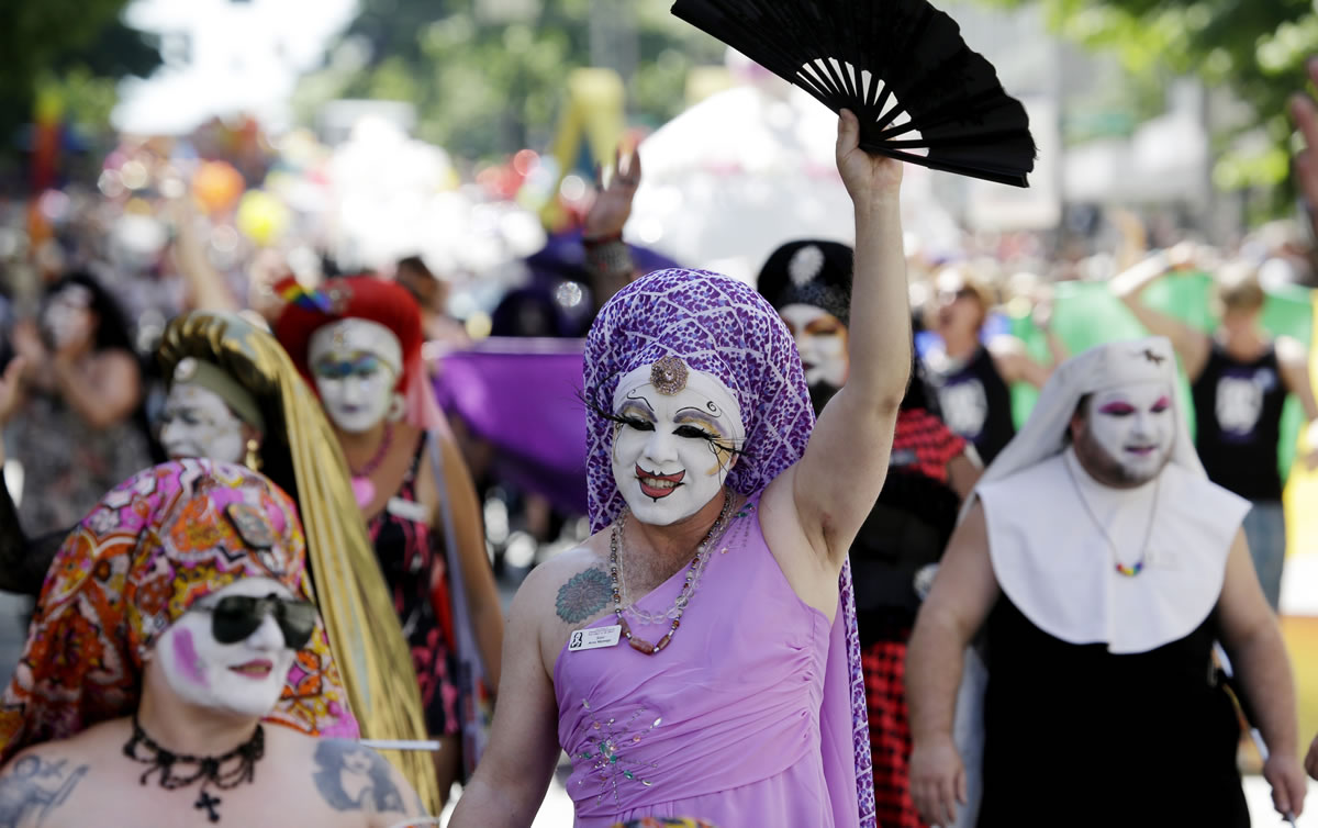 Members of the Sisters of Perpetual Indulgence march in the annual Gay Pride parade Sunday, June 30, 2013, in Seattle.