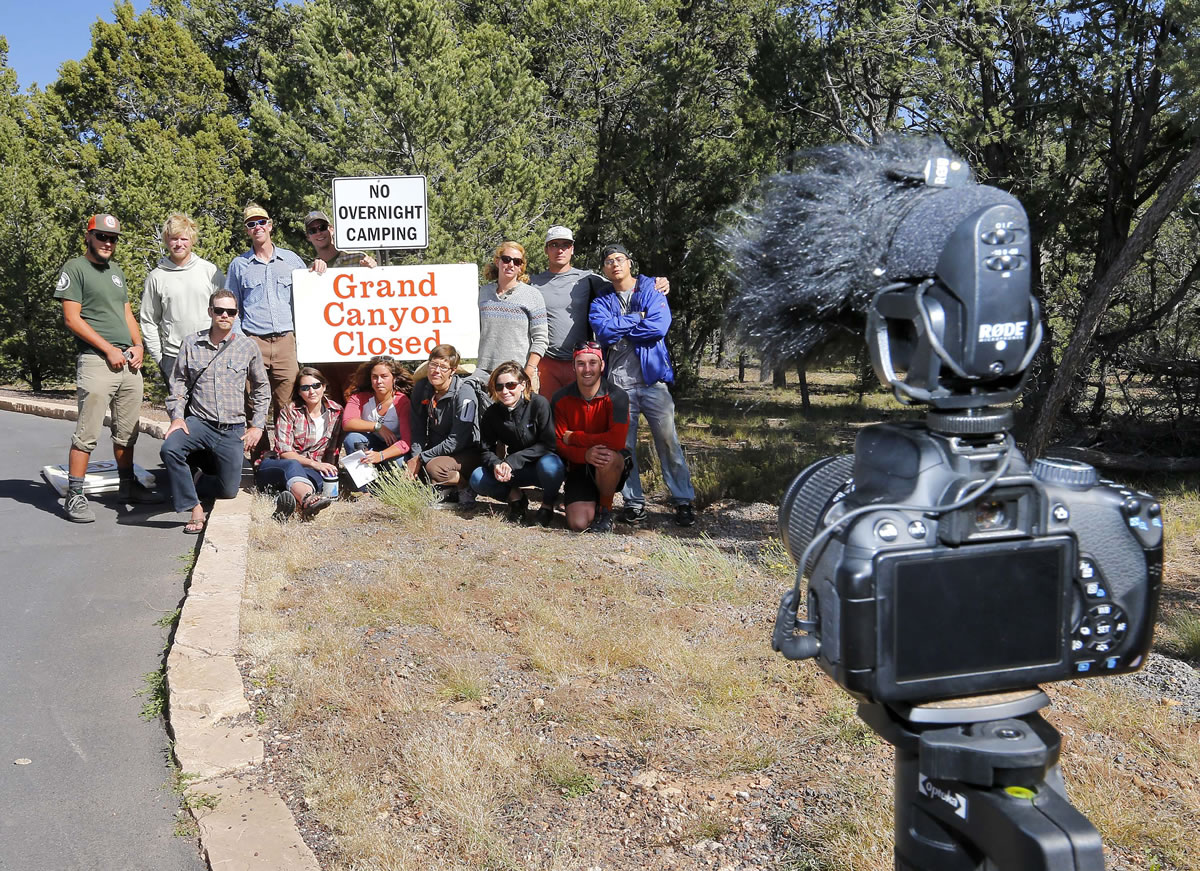Students from Prescott College pose for a self-timed photograph at the Grand Canyon National Park entrance, Tuesday in Tusayan, Ariz.