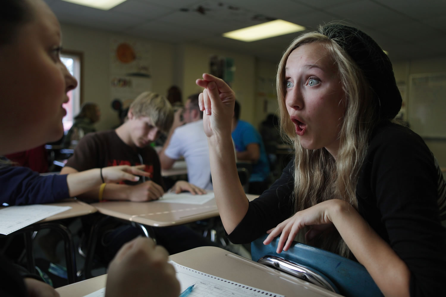 Carrie Hayes, right, signs Wednesday during a group activity in a sign language class at Sultan High School in Sultan.