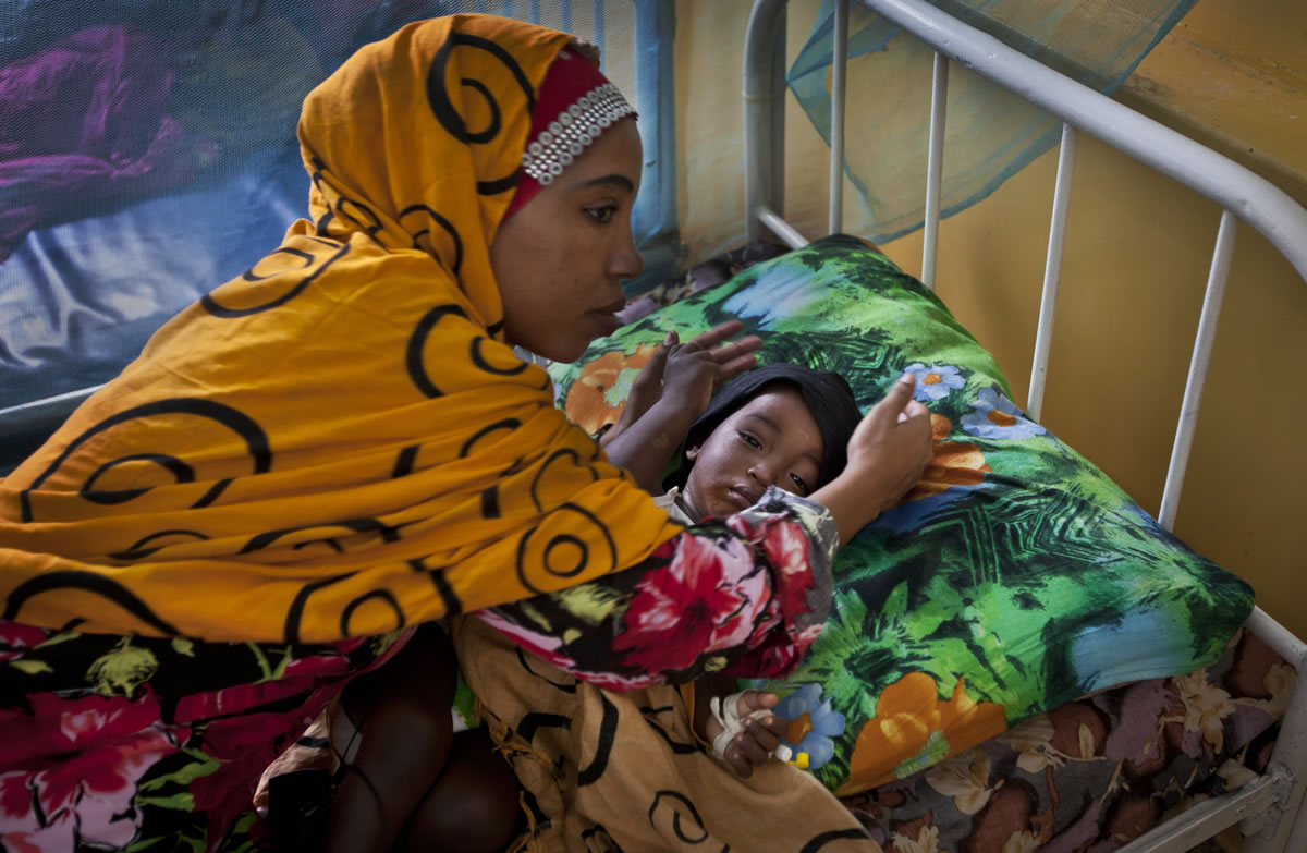A Somali mother cares for her child in an isolation ward full of children with measles or meningitis at the Benadir hospital in Mogadishu, Somalia, on Wednesday.