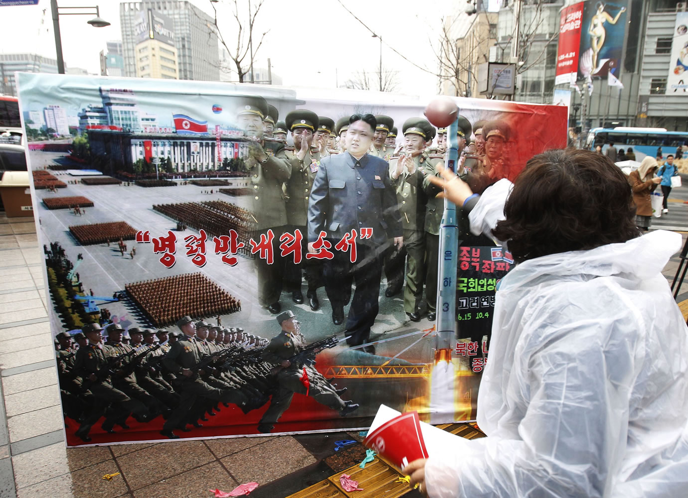 A South Korean conservative activist hurls a water balloon at a portrait of North Korean leader Kim Jong Un during a rally denouncing North Korea's recent threat for war in Seoul, South Korea, on Tuesday.