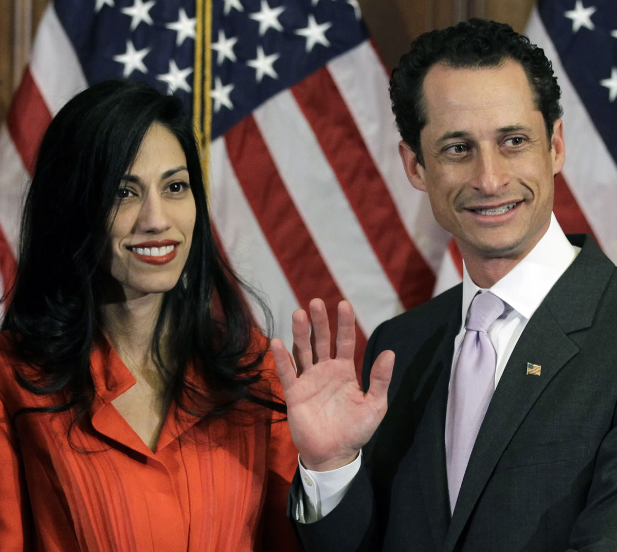 Anthony Weiner and his wife Huma Abedin pose for photographs after the ceremonial swearing in of the 112th Congress on Capitol Hill in Washington in January 2011.