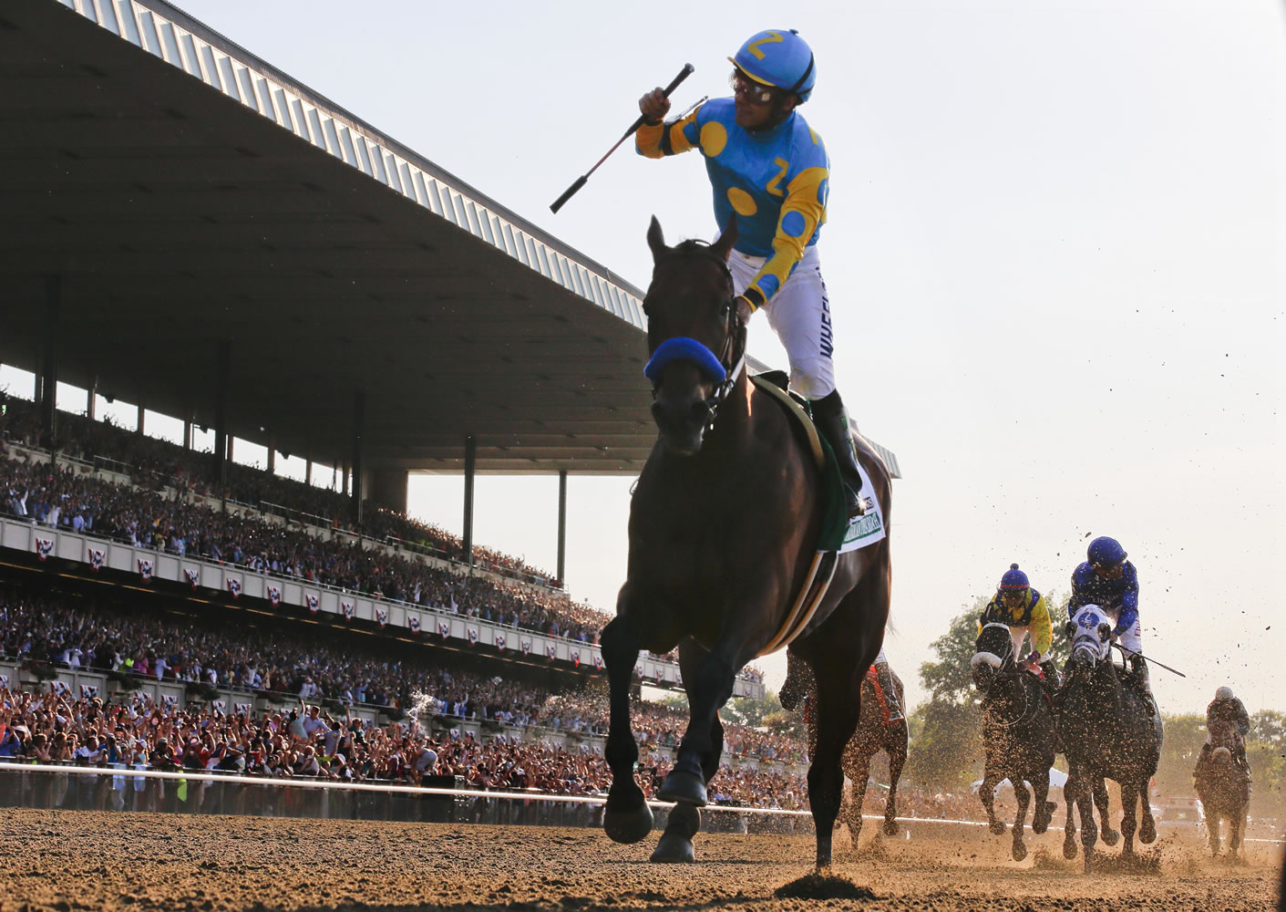 Victor Espinoza reacts after crossing the finish line with American Pharoah to win the Belmont Stakes on June 6, 2015, at Belmont Park in Elmont, N.Y. American Pharoahs sweep of the Kentucky Derby, Preakness and Belmont Stakes for horse racings first Triple Crown since 1978 was selected the sports story of the year Thursday, Dec. 24, 2015, in an annual vote conducted by The Associated Press.