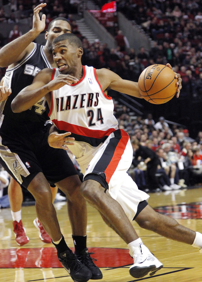 Don Ryan/The Associated Press
Portland Trail Blazers guard Ronnie Price, right, drives on San Antonio Spurs guard Gary Neal during the first half.
