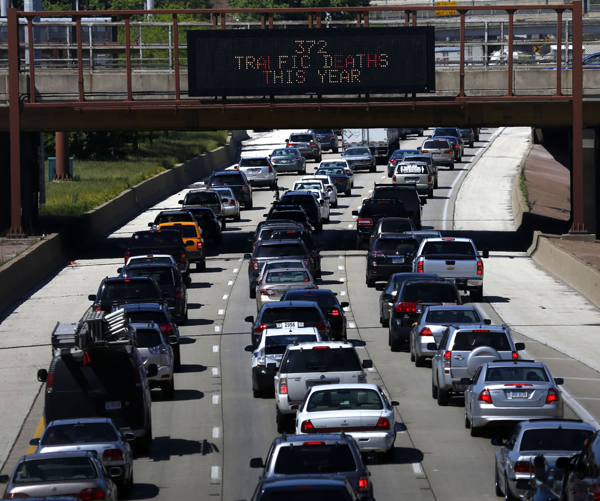 Traffic on a Chicago interstate begins to thicken Friday afternoon as travelers head to Memorial Day destinations in Indiana and Michigan.