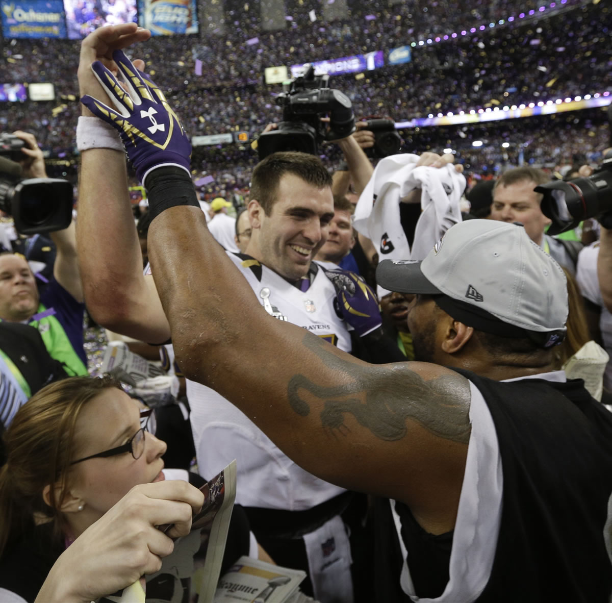 Baltimore Ravens quarterback Joe Flacco, left, and linebacker Ray Lewis celebrate their 34-31 win against the San Francisco 49ers in the NFL Super Bowl XLVII.