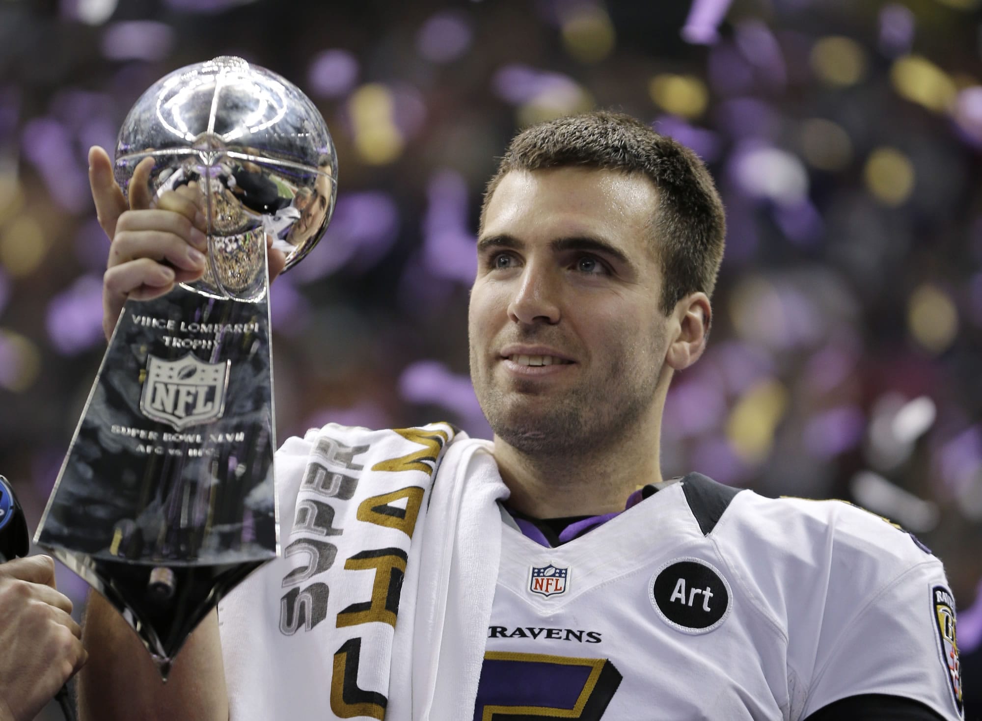 Baltimore Ravens quarterback Joe Flacco holds the Vince Lombardi Trophy after defeating the San Francisco 49ers 34-31 in Super Bowl XLVII.