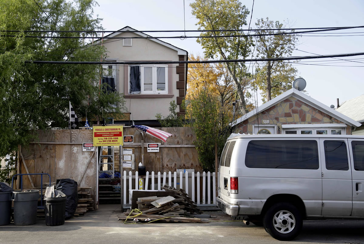A house being raised high above street level is under construction in the Midland Beach section of Staten Island, New York, on Tuesday.