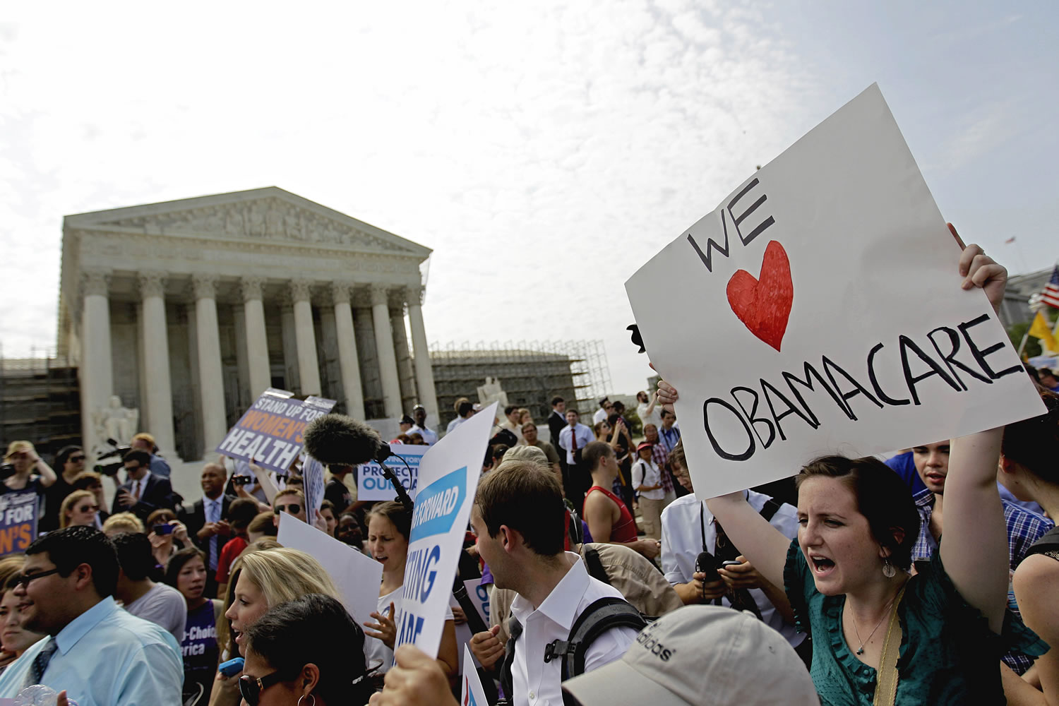 Supporters of President Barack Obama's health care law celebrate outside the Supreme Court in Washington after the court's ruling was announced last month.