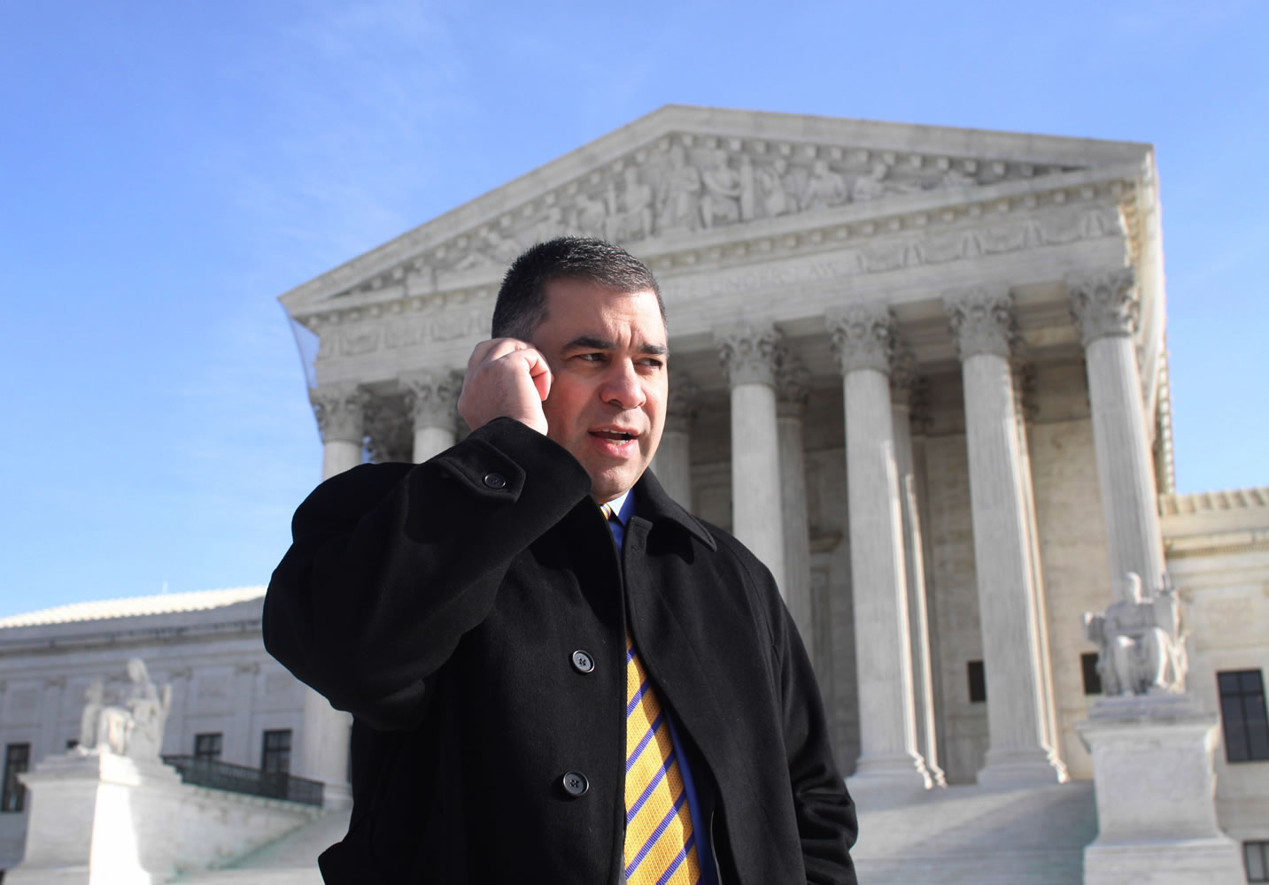 Citizens United President David Bossie talks on his phone outside the Supreme Court in January 2010 after the 5-4 ruling that allowed corporations and labor unions to spend unlimited sums in support of or opposition to candidates.