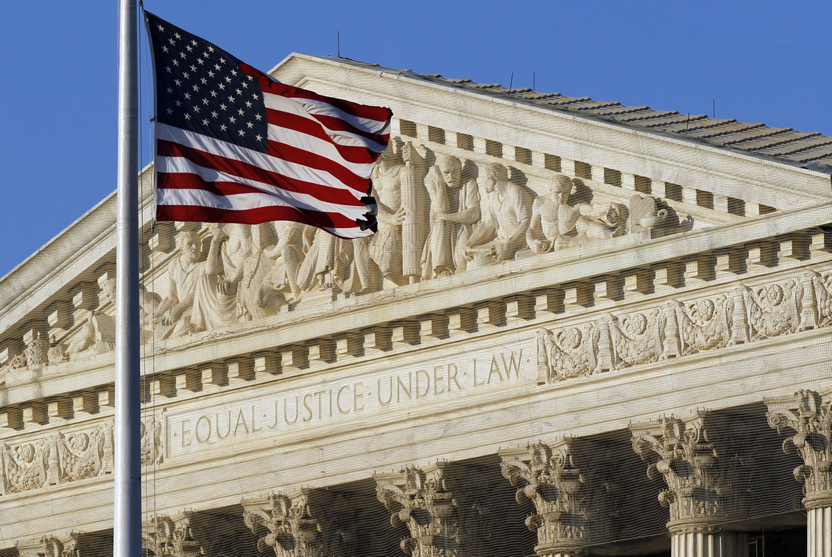 An American flag flies in front of the Supreme Court in Washington.