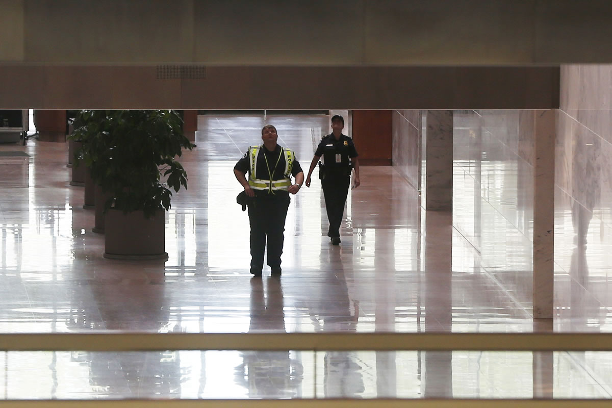 Capitol Police officers secure the atrium of the Hart Senate Office Building on Capitol Hill in Washington on Wednesday after reports of suspicious packages discovered on Capitol Hill.