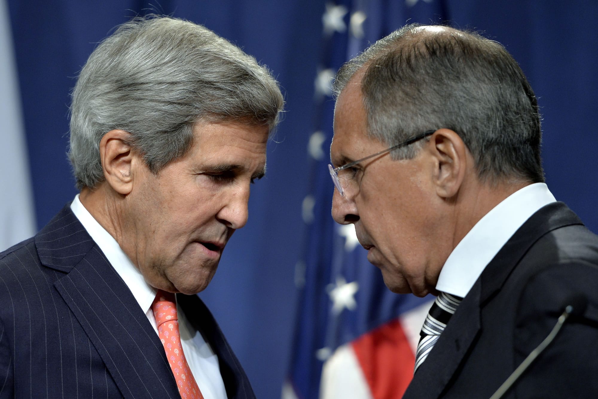 U.S. Secretary of State John Kerry, left, speaks with Russian Foreign Minister Sergei Lavrov, right, during  a news conference Saturday in Geneva, Switzerland. Kerry and Lavrov said Saturday they have reached an agreement on a framework for Syria to destroy all of its chemical weapons, and would seek a U.N.