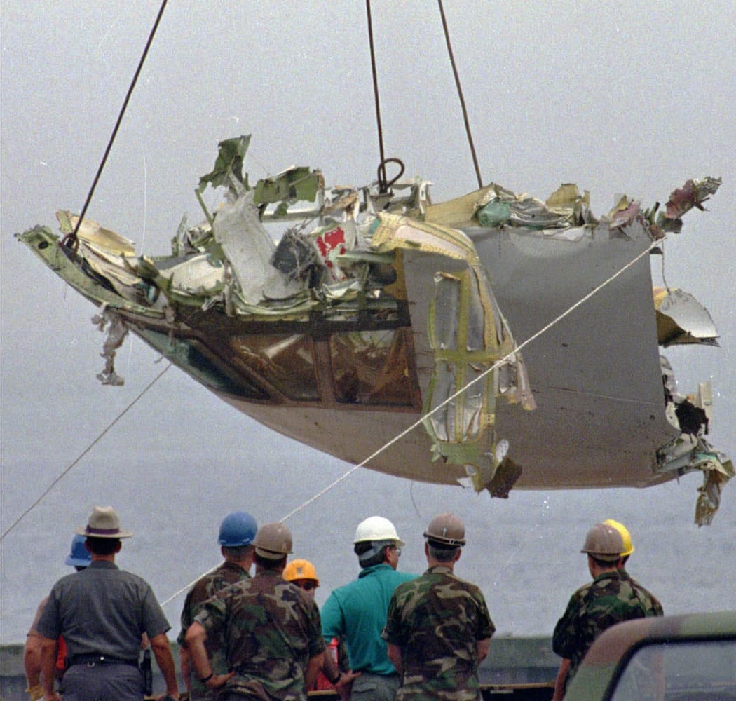 The cockpit of TWA Flight 800 is lowered at the U.S. Coast Guard station at Shinnecock Inlet in Hampton Bays, N.Y. on Aug.