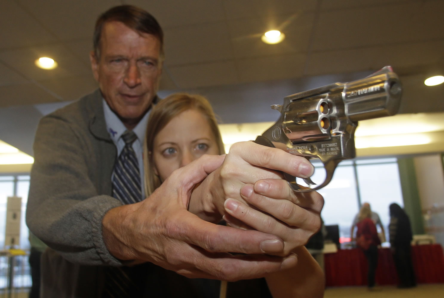 Cori Sorensen, a fourth-grade teacher from Highland Elementary School in Highland, Utah, gets training with a .357 magnum from personal defense instructor Jim McCarthy on Thursday during concealed weapons training for 200 Utah teachers in West Valley City, Utah.