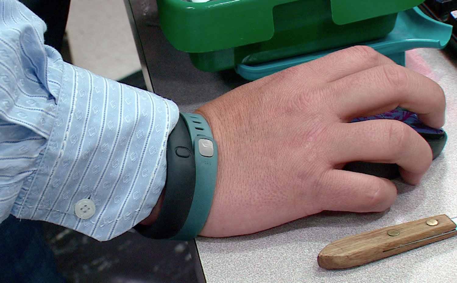 Tim Davis of Beaver, Pa., wears his FitBit and Nike FuelBand.