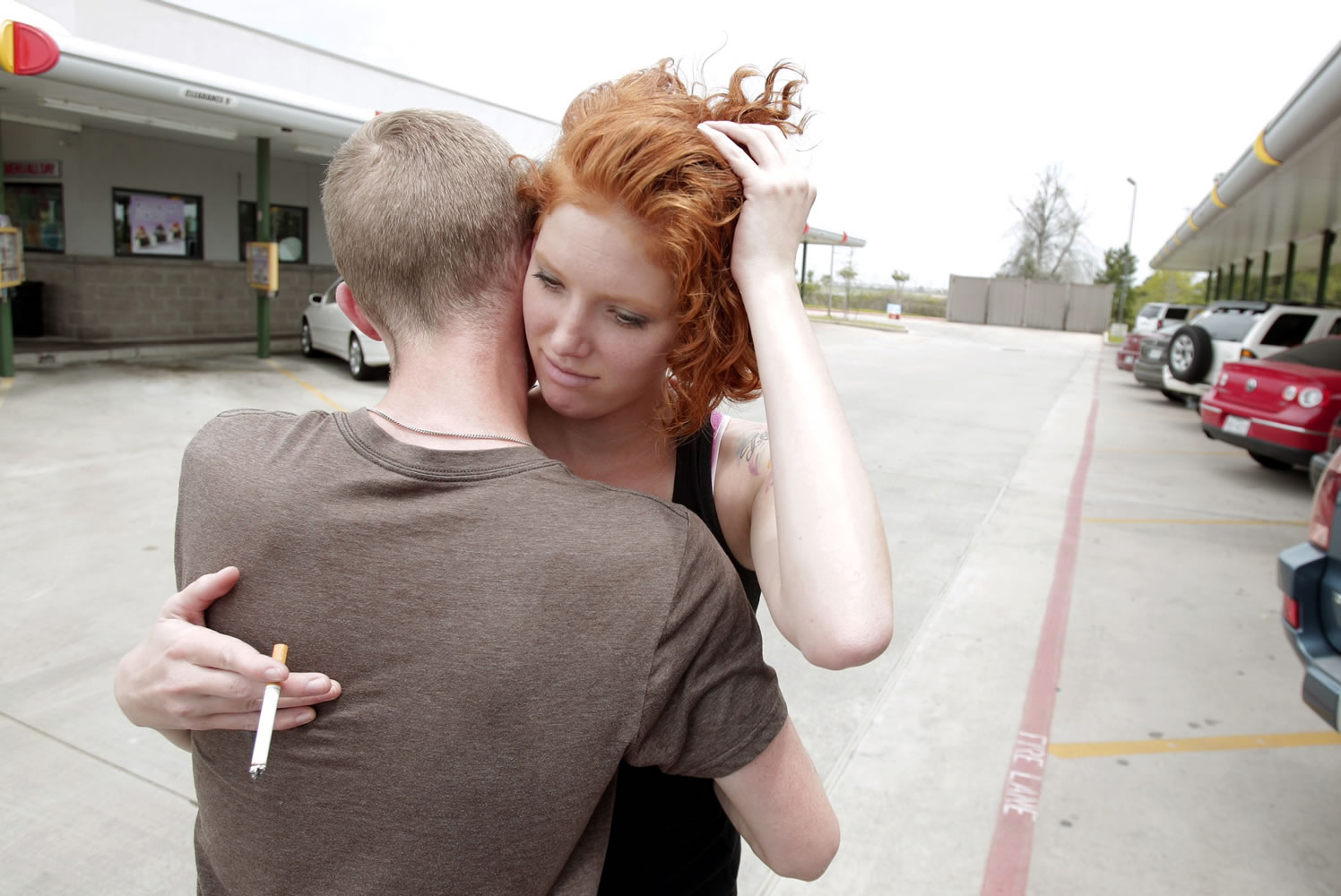 Cassie Foe hugs classmate Christian Wilson after leaving from the Cy-Fair campus of Lone Star Community College in Cypress, Texas, where she witnessed a male getting stabbed on Tuesday.