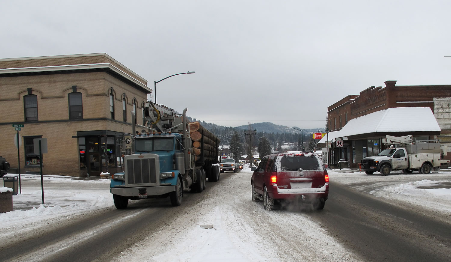 A logging truck moves through the center of St. Maries, Idaho, last month, near where a survivalist group plans to build a compound.
