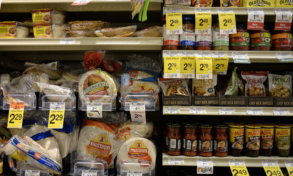 Tortillas and other items are fill shelves in the international food aisle of a grocery store Wednesday in Washington.
