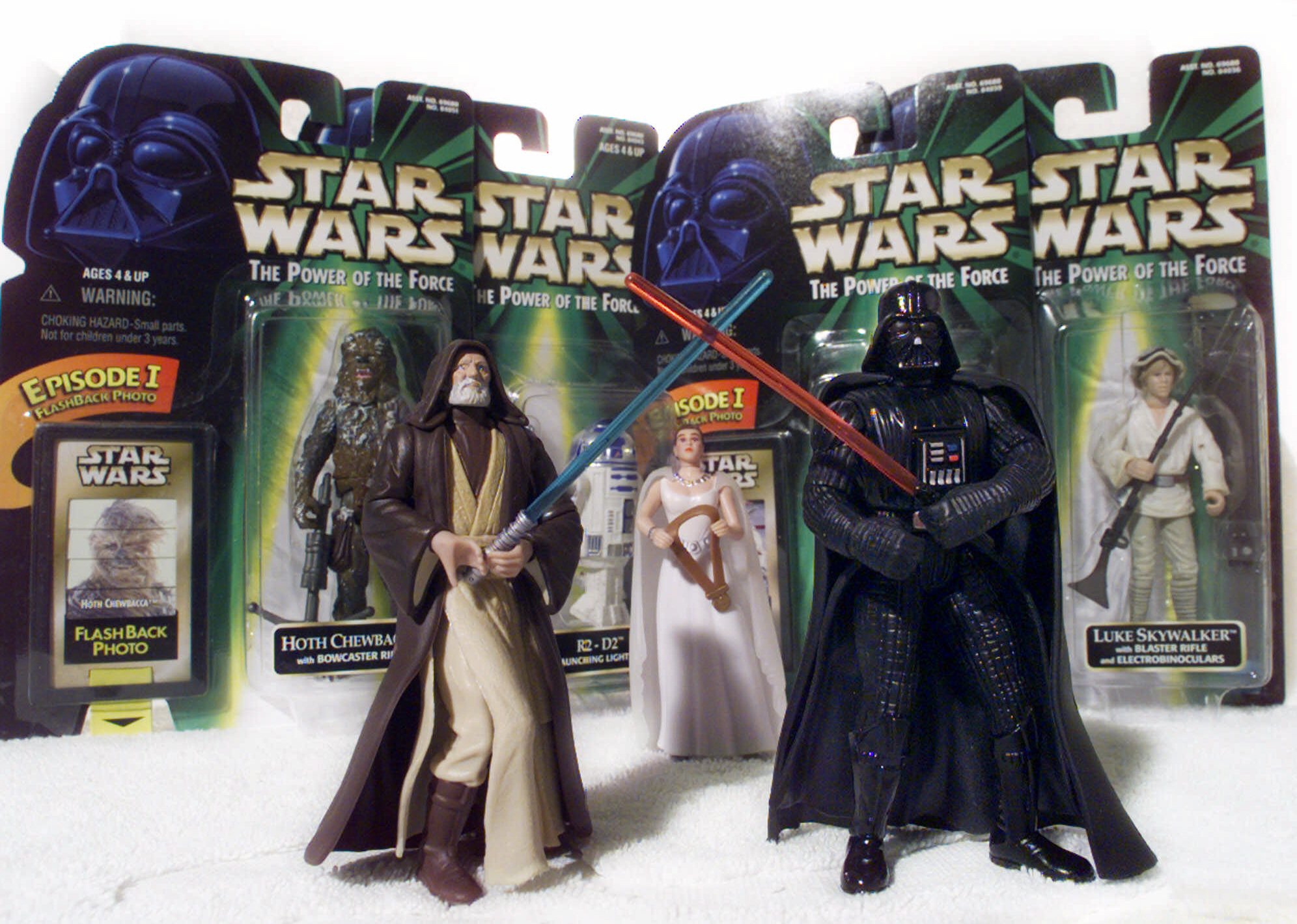 &quot;Star Wars&quot; action figures Darth Vader, right, and Ben (Obi-Wan) Kenobi, left, are displayed in 1999, with Princess Leia Organa in her ceremonial dress, in front of other packaged characters from the film series.