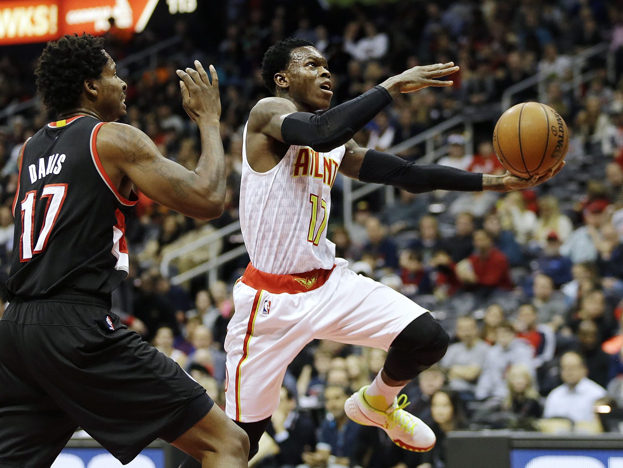 Atlanta Hawks&#039; Dennis Schroder, right, of Germany, put up a shot against Portland Trail Blazers&#039; Ed Davis in the second quarter of an NBA basketball game Monday, Dec. 21, 2015, in Atlanta. The Hawks won 106-97.