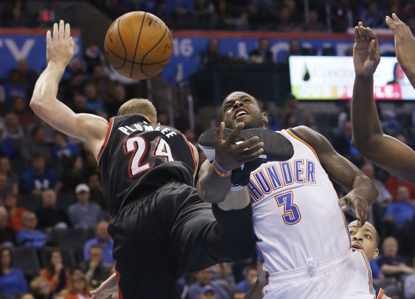 Oklahoma City Thunder guard Dion Waiters (3) loses the ball between Portland Trail Blazers center Mason Plumlee (24) and guard C.J. McCollum during the third quarter of an NBA basketball game in Oklahoma City, Wednesday, Dec. 16, 2015. Oklahoma City won 106-90.