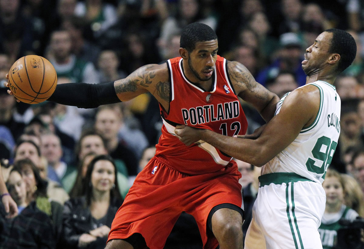Portland Trail Blazers' LaMarcus Aldridge (12) looks to move against Boston Celtics' Jason Collins (98) in the first quarter Friday.