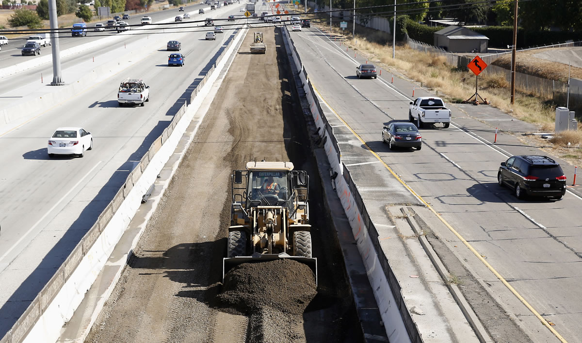 Vehicles pass a highway construction site on eastbound Interstate 80 in Sacramento, Calif. The House and Senate have reached agreement on a 5-year, $281 billion transportation bill that would increase spending to address the nation&#039;s aging and congested highways and transit systems -- a legislative feat that lawmakers and President Barack Obama have struggled throughout his entire administration to achieve.