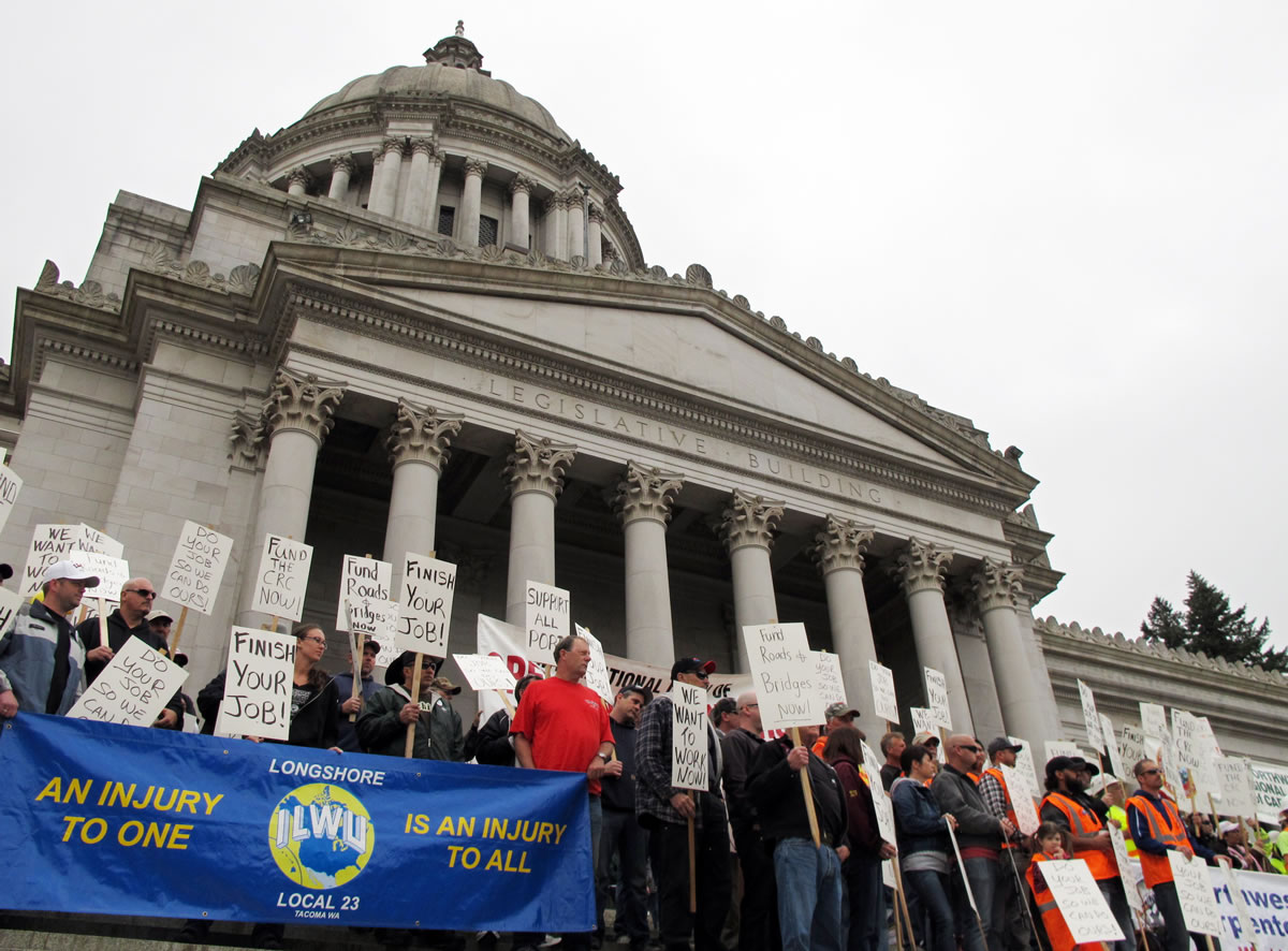 Supporters of a transportation revenue package hold a rally on the Capitol steps on Monday in Olympia. Lawmakers are in the midst of a 30-day special legislative session to address the main state operating budget, but Gov.
