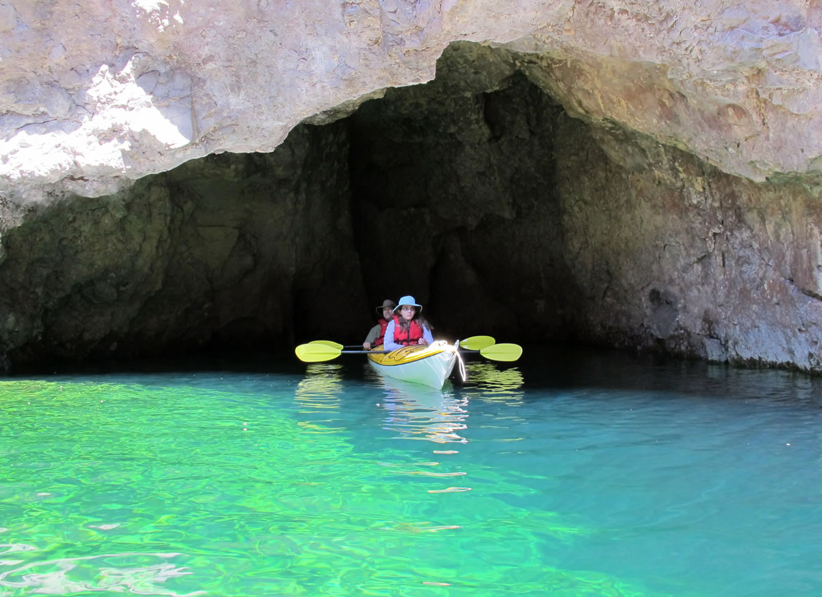 Kayakers paddle at Emerald Cave on the Arizona side of the Colorado River.