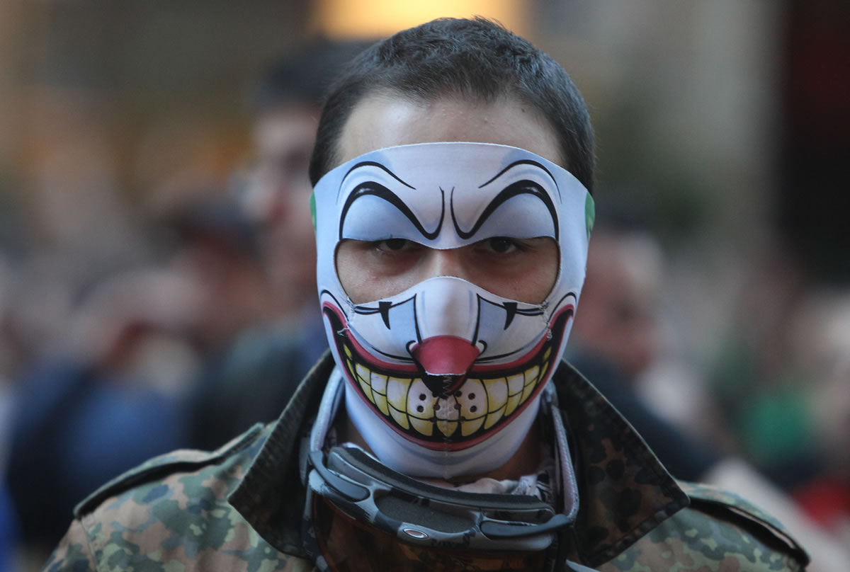 A man wears a mask during the third day of nationwide anti-government protests at Taksim square in Istanbul on Sunday.