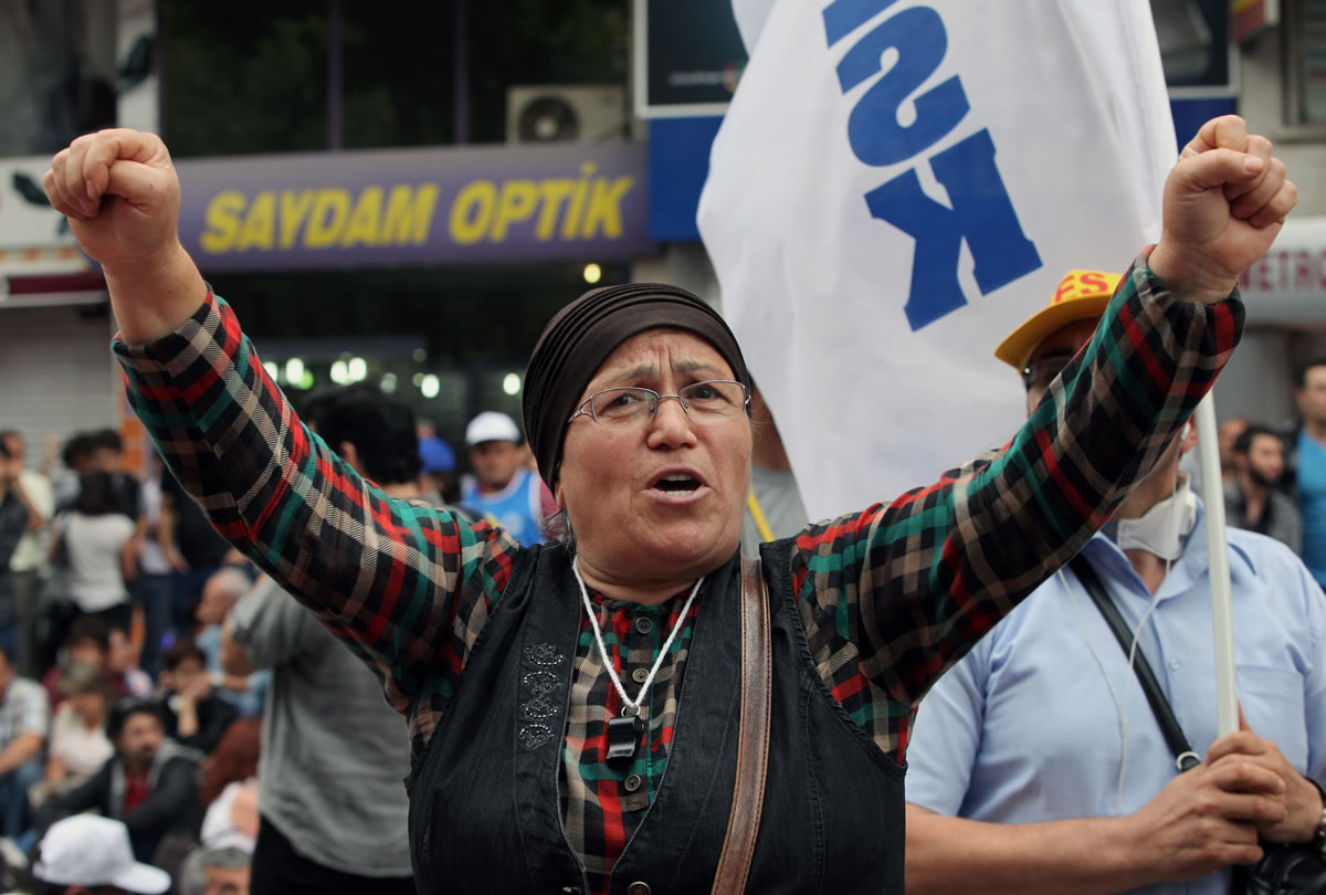 A woman shouts anti-government slogans during a rally by the labor unions in Ankara, Turkey, on Monday.