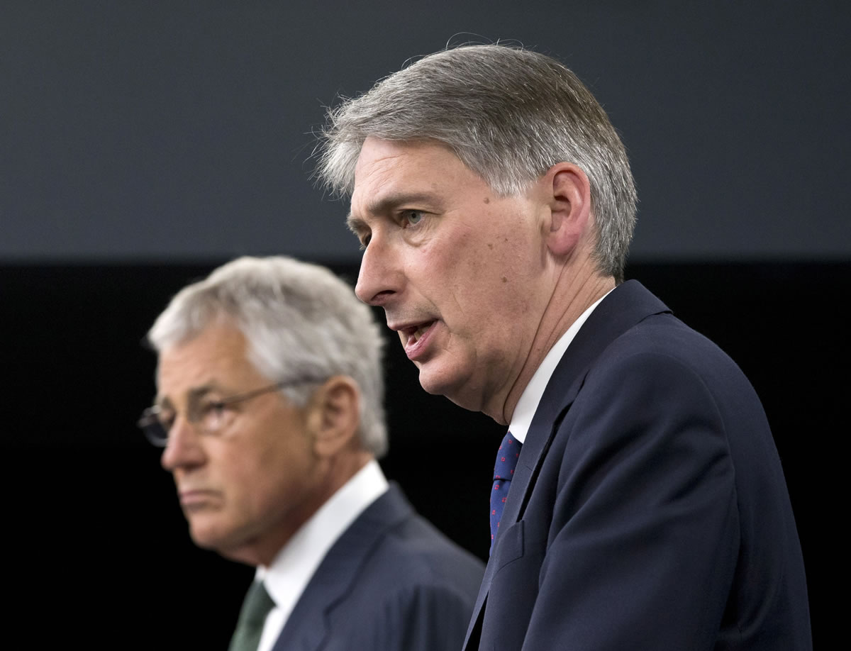 Defense Secretary Chuck Hagel and British Defense Secretary Philip Hammond participate in a  joint news conference at the Pentagon, Thursday, May 2, 2013, where the talked about Syria.  (AP Photo/J.