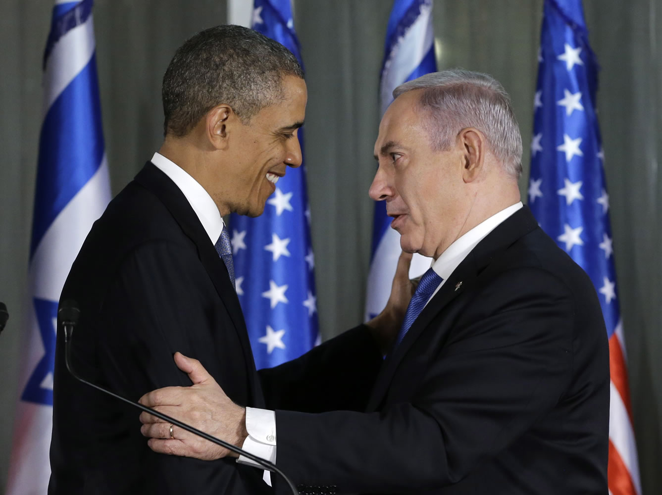 President Barack Obama and Israeli Prime Minister Benjamin Netanyahu shake hands as they participate in a joint news conference Wednesday at the prime minister's residence in Jerusalem.