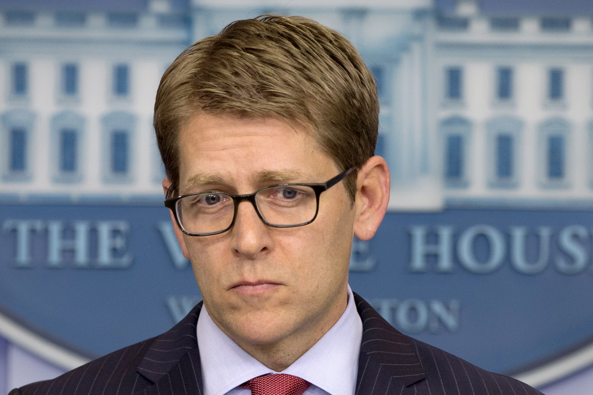 White House press secretary Jay Carney listens to a question from a reporter during his daily news briefing at the White House in Washington as he answers questions about NSA leaker Edward Snowden and Russia.