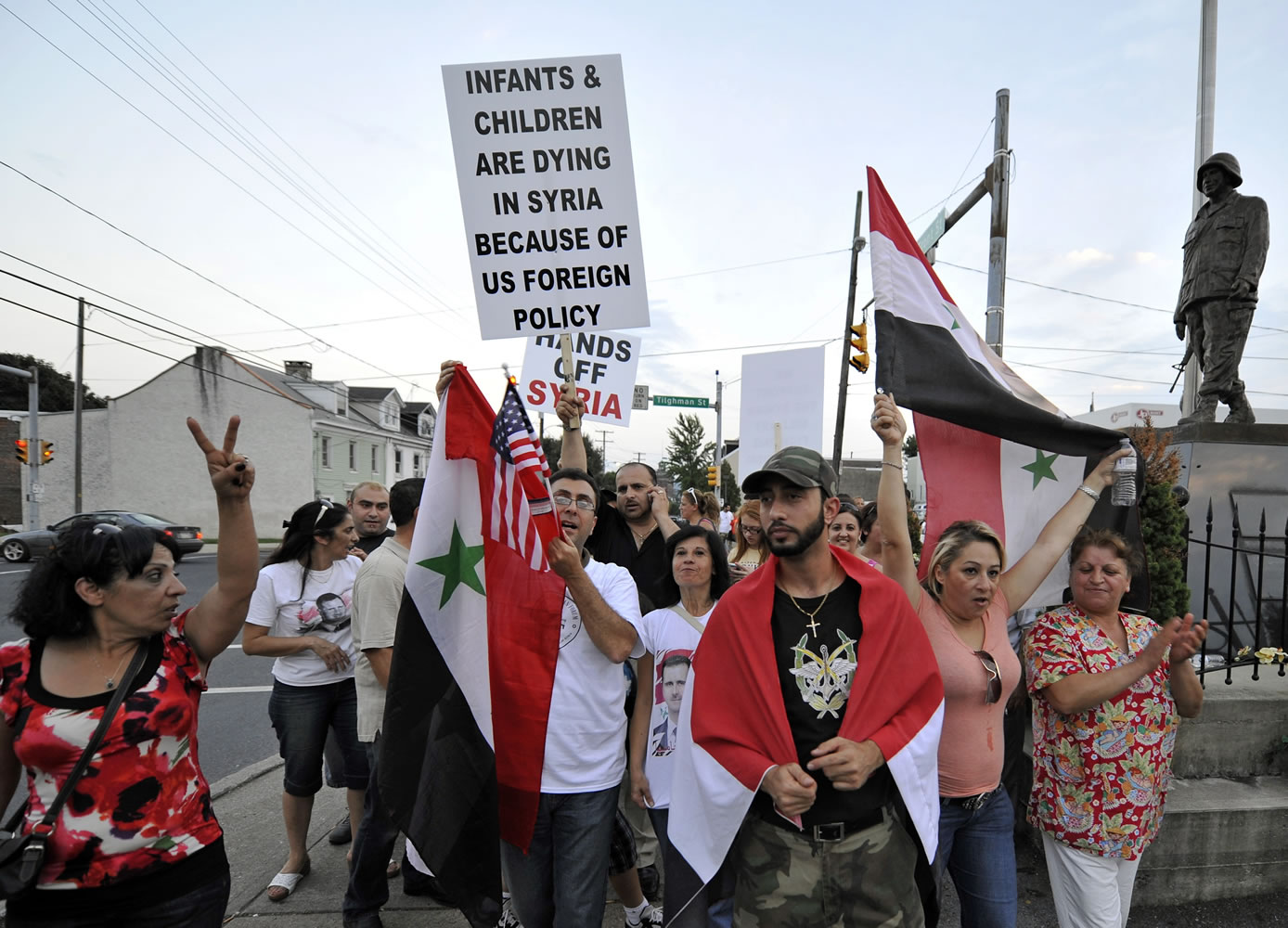 Members of the local Syrian community rally against the United States' involvement in Syria on Tuesday in Allentown, Pa.