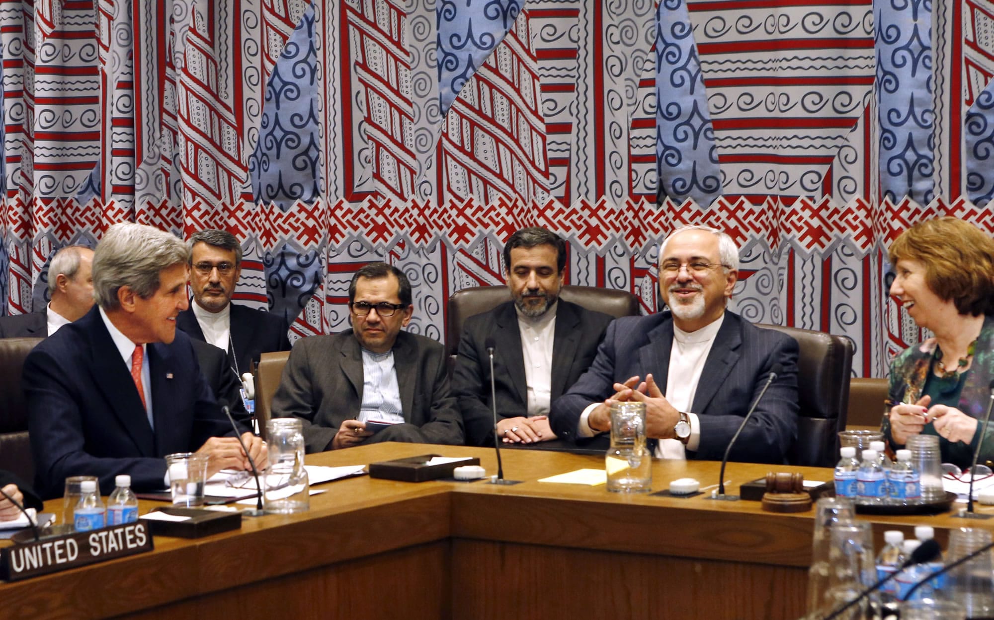 Iranian foreign minister Mohammad Javad Zarif, second from right, confers with U.S.