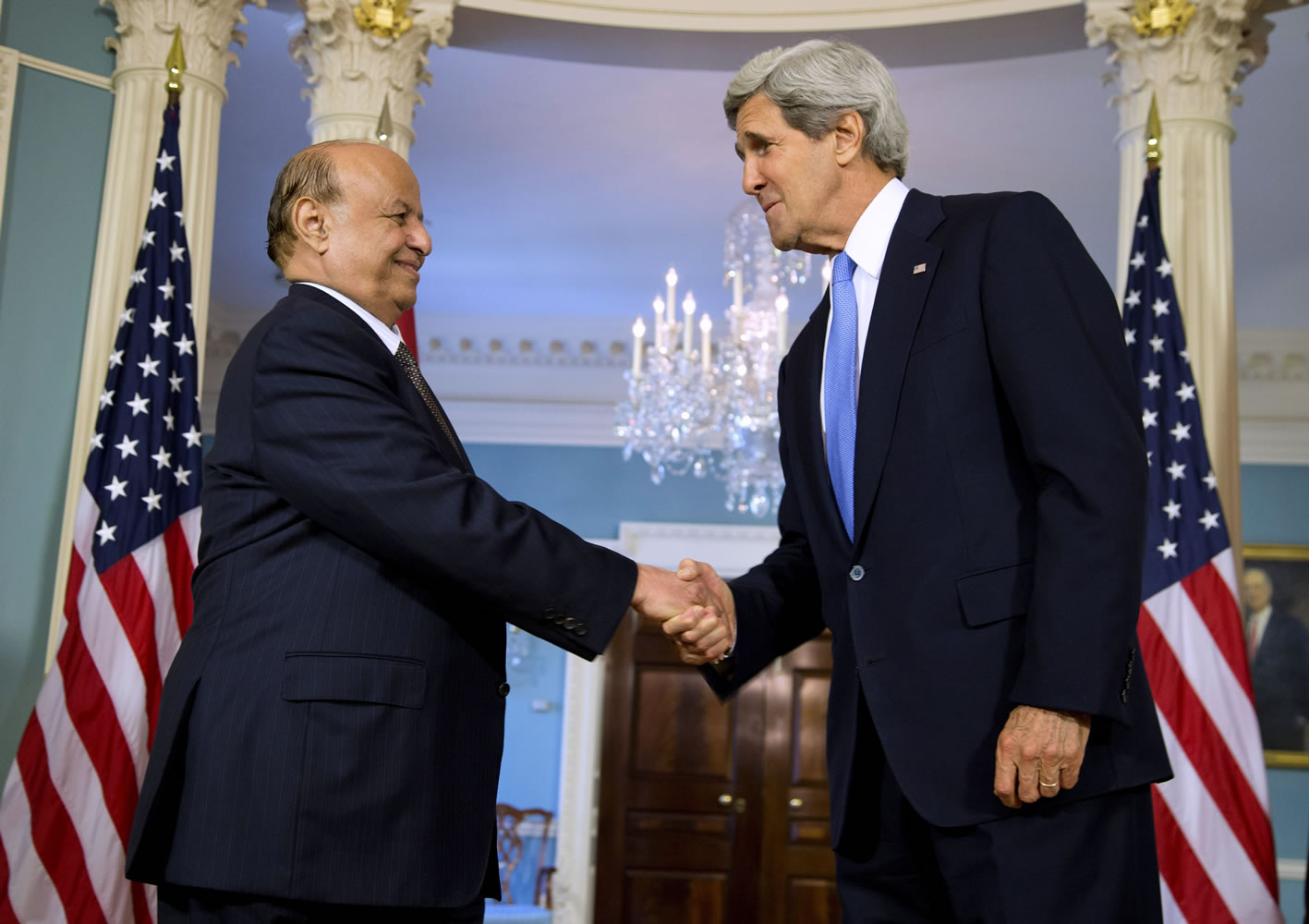 Secretary of State John Kerry shakes hands with Yemen's President Abed Rabbo Mansour Hadi on Monday at the State Department in Washington.