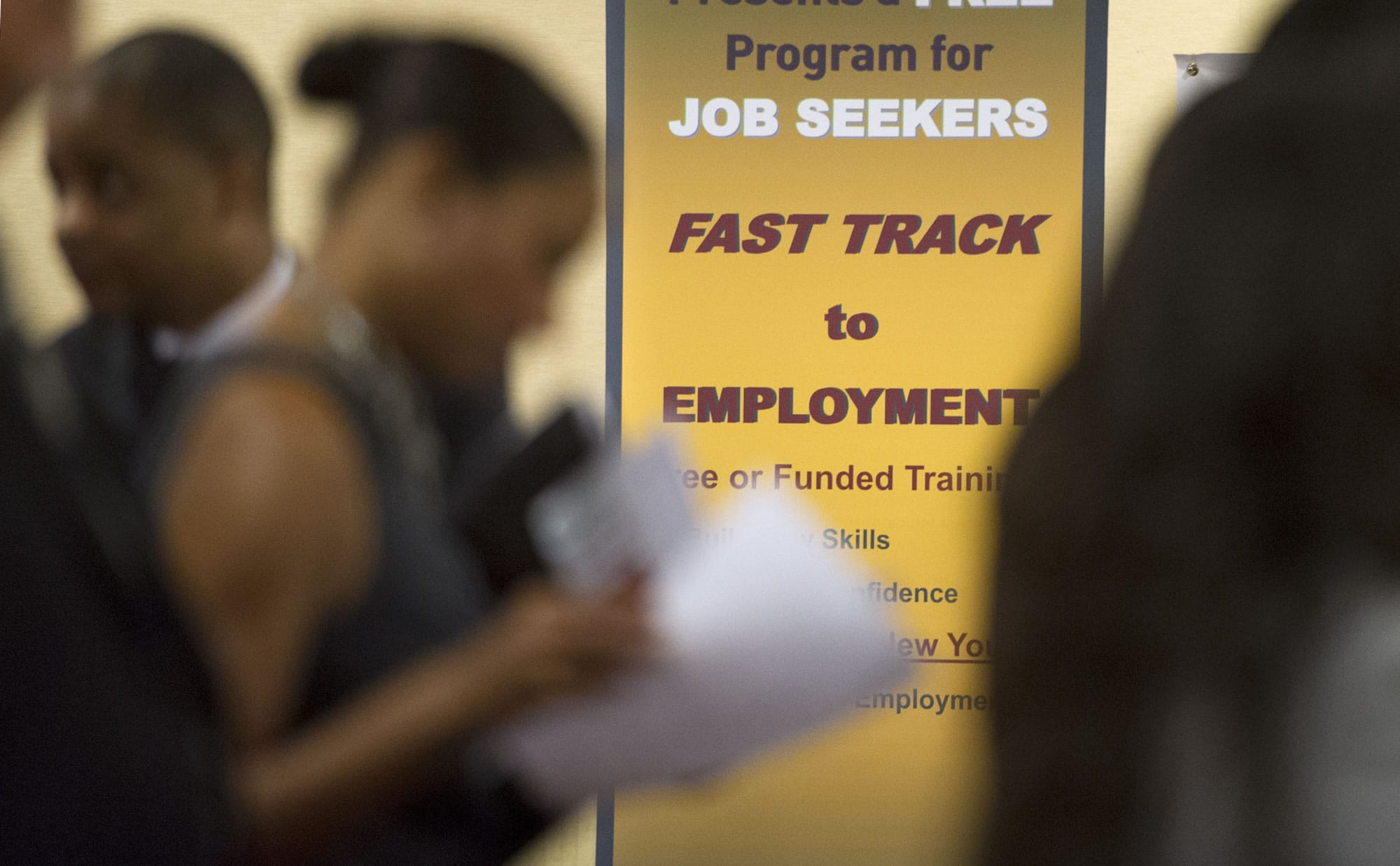 Job seekers line up to talk to recruiters during a job fair held in Atlanta in May.