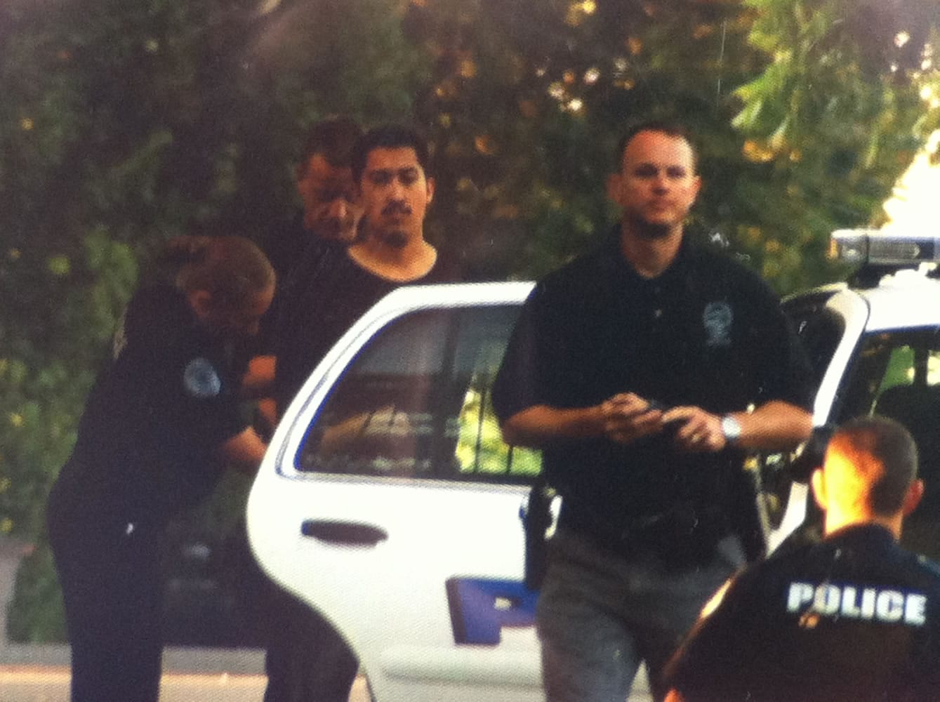 Police place Jeremy Pina, 21, of Vancouver, into a squad car Monday morning.