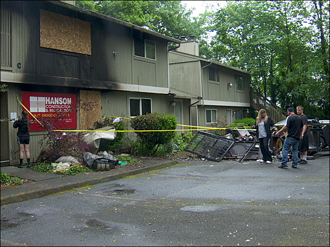 Three Vancouver police officers pulled a woman from a fire that was reported 1:23 a.m. Sunday at a four-plex at 2904 E. 16th St.