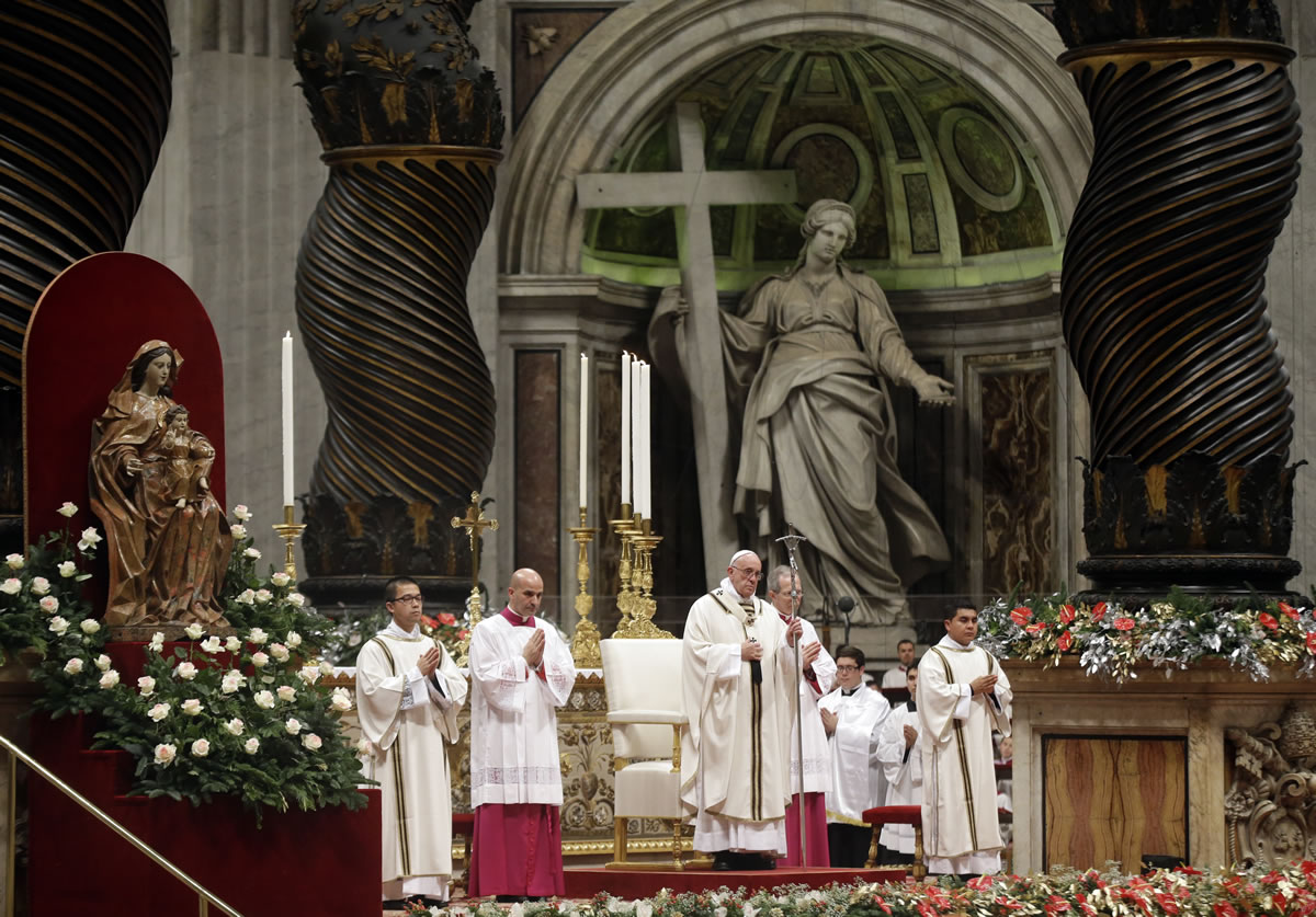 Pope Francis holds the pastoral staff as he celebrates the Christmas Eve Mass in St. Peter&#039;s Basilica at the Vatican on Thursday.