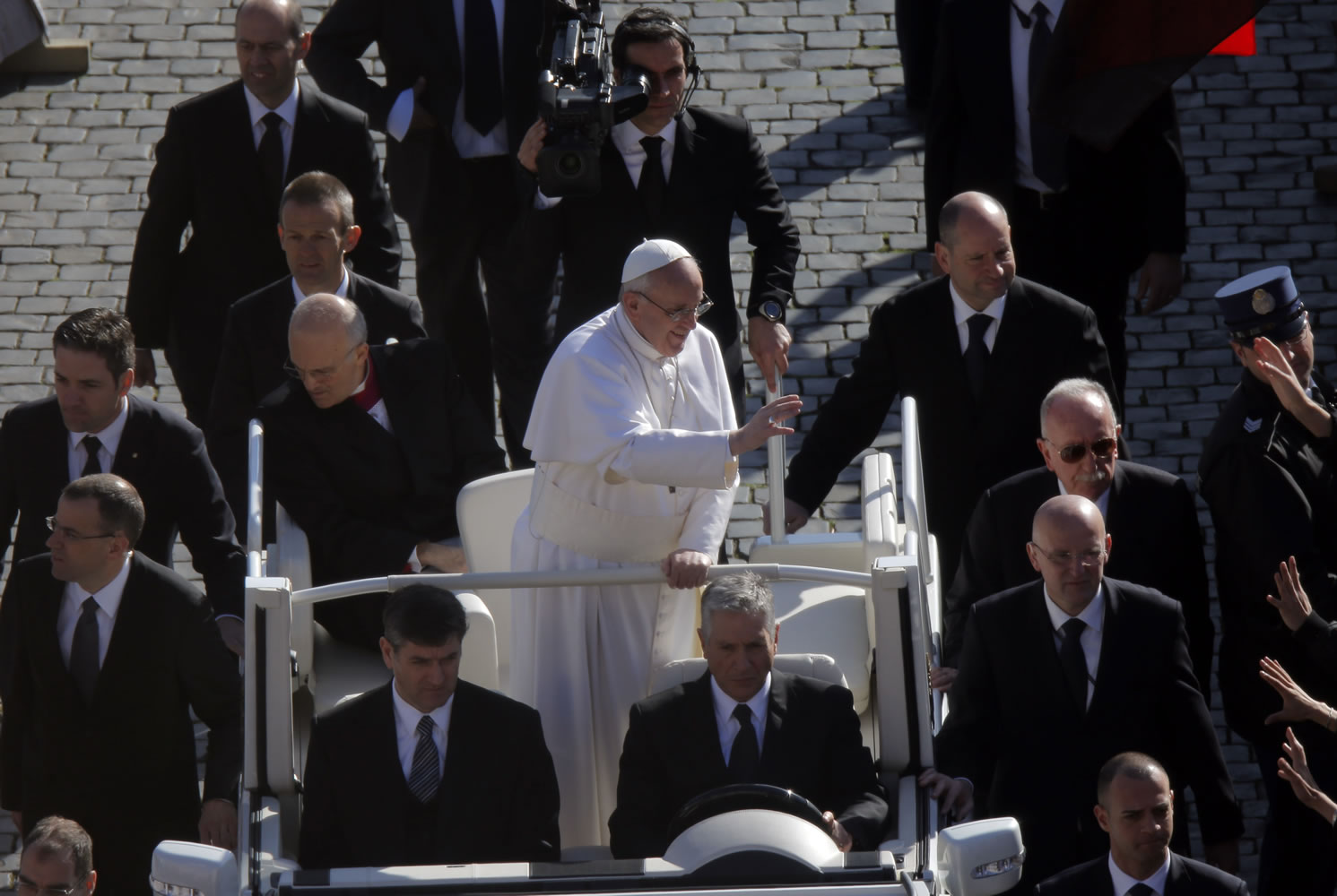 Pope Francis waves upon his arrival in St.