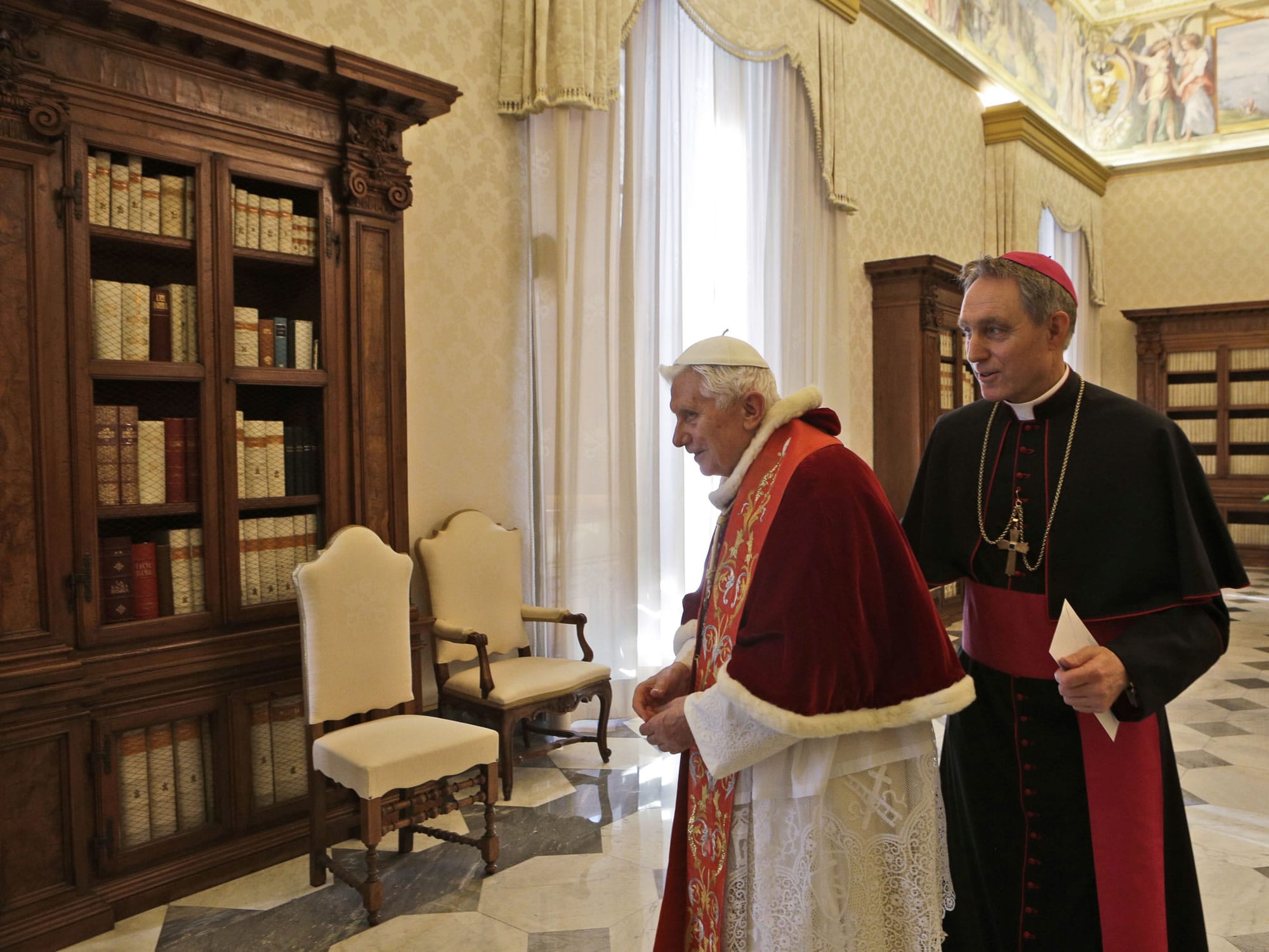 Pope Benedict XVI and his personal secretary Georg Gaenswein leave after meeting Guatemala's President Otto Perez Molina, not seen, during a private audience at Vatican on Saturday.