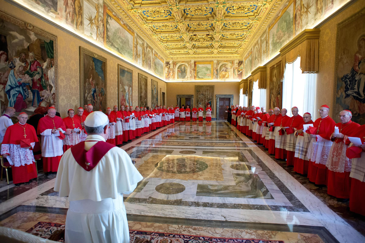 Pope Francis stands with cardinals during a consistory at the Vatican in September.