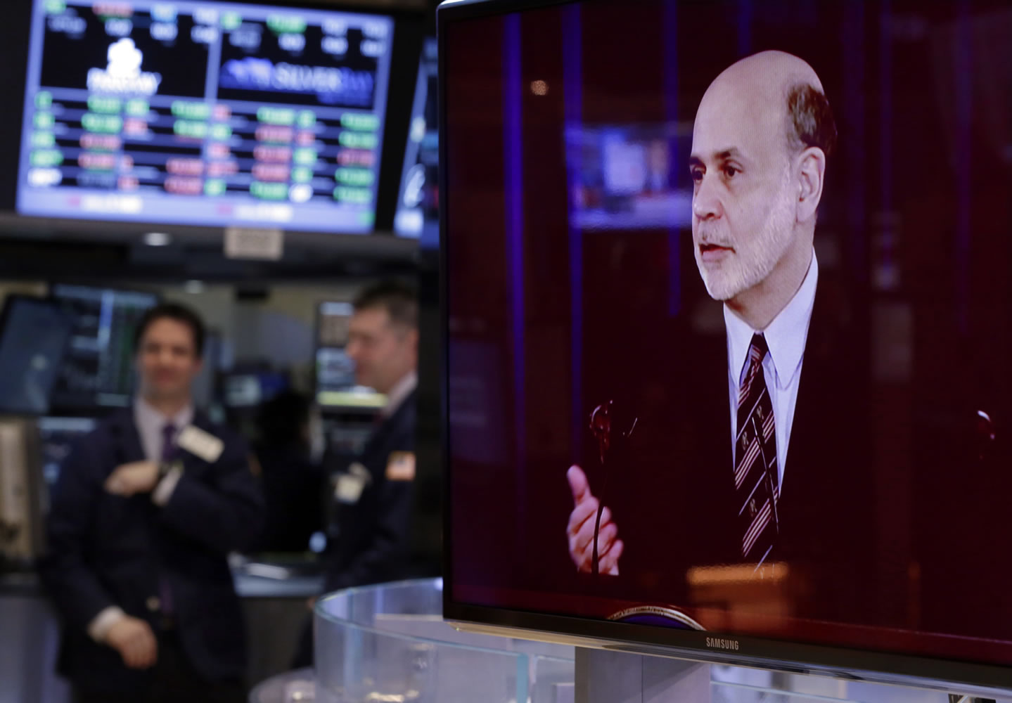 A television screen on the floor of the New York Stock Exchange shows the news conference of Federal Reserve Chairman Ben Bernanke on Wednesday.